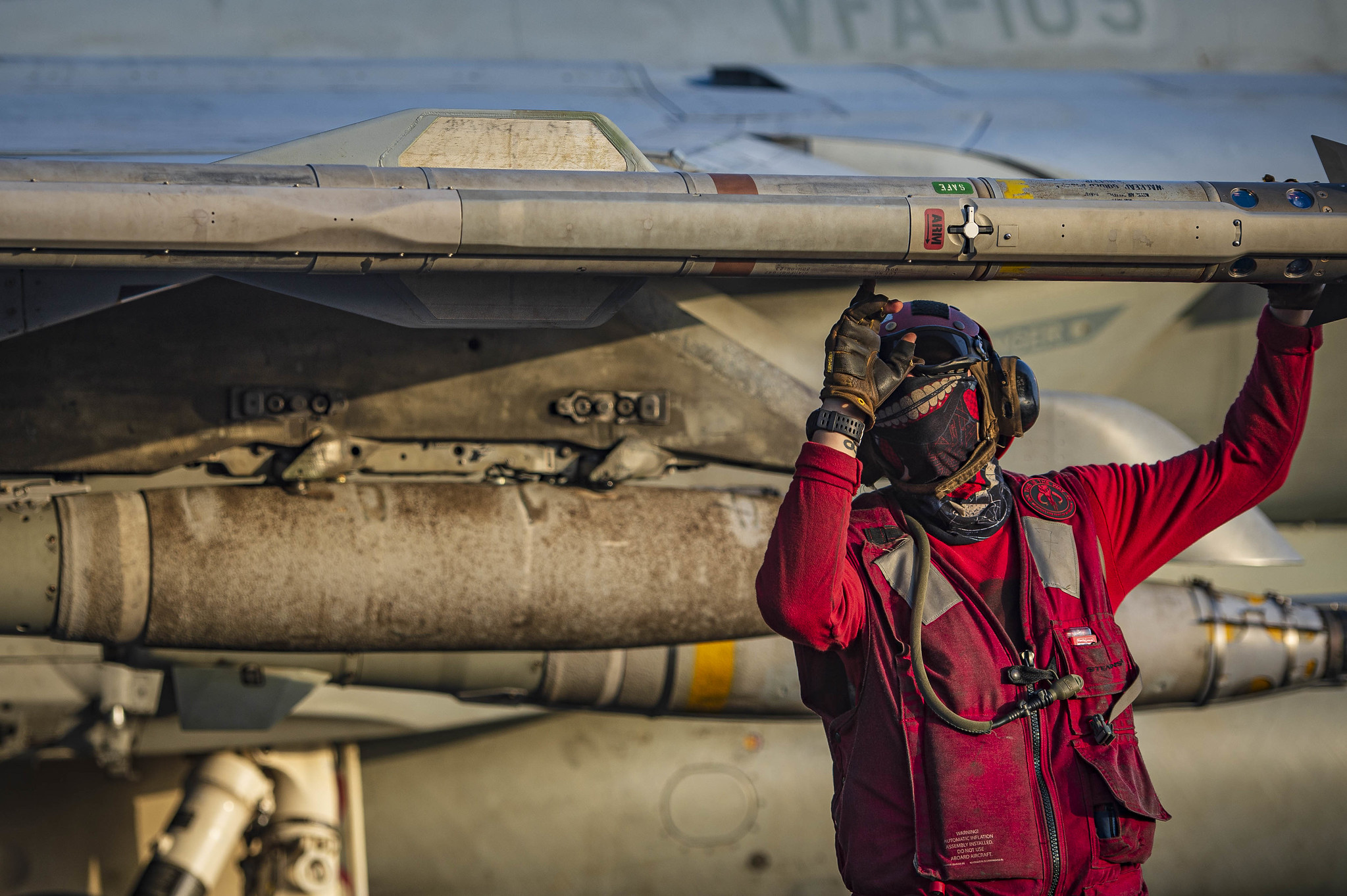 Aviation Ordnanceman Airman Ethan Sauer performs pre-flight ordnance checks on a F/A-18E Super Hornet on May 4, 20121, during flight operations aboard aircraft carrier USS Dwight D. Eisenhower (CVN 69) in the Arabian Sea. (Mass Communication Specialist Seaman Mo Bourdi/Navy)