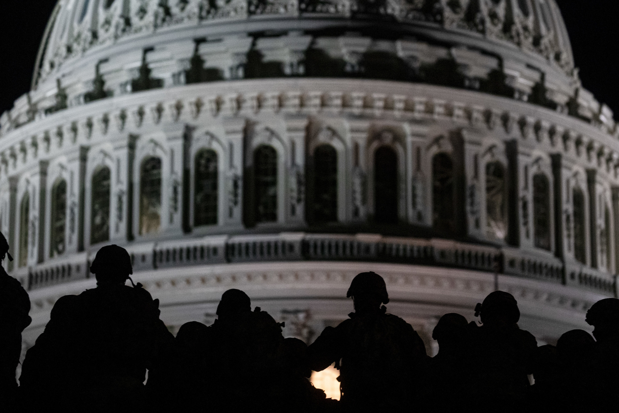 U.S. soldiers with the Virginia National Guard listen to a squad leader briefing after arriving near the Capitol in Washington on, Jan. 13, 2021. (Master Sgt. Matt Hecht/Air National Guard)