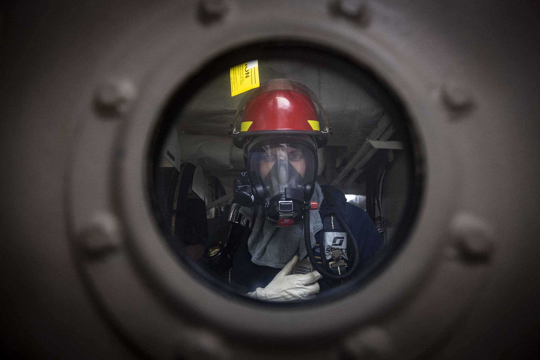 Chief Gunner's Mate Ken Marsh stands by as scene leader during a damage control drill aboard the Freedom-variant littoral combat ship USS Detroit (LCS 7) on July 3, 2020, in the Caribbean Sea. (MC2 Anderson W. Branch/Navy)