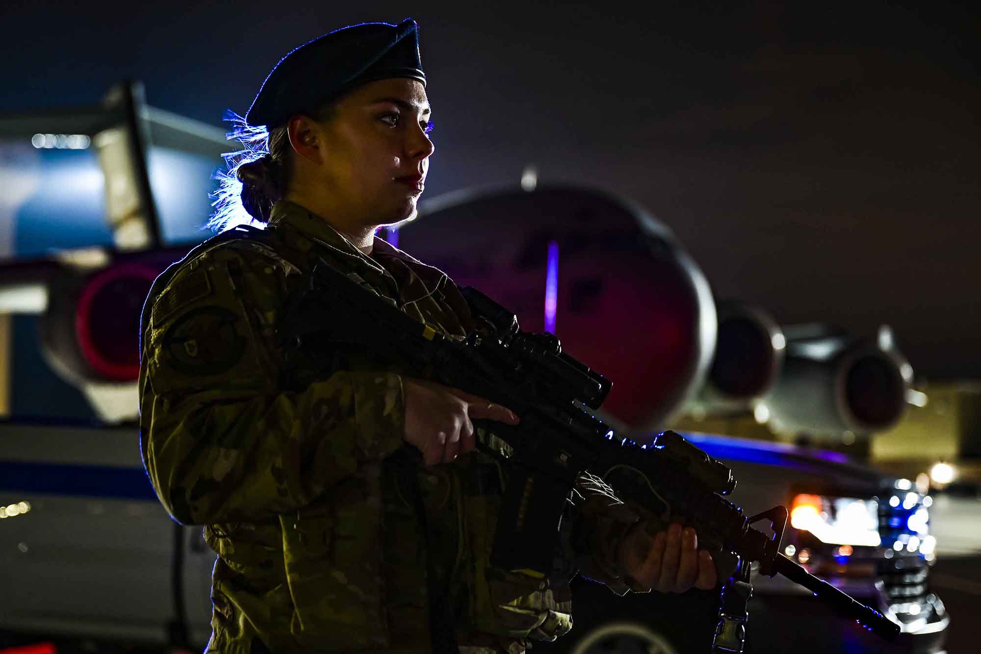 Senior Airman Alexis Williams, 911th Security Forces Squadron patrolman, stands guard in front of a C-17 Globemaster III during a routine training exercise at the Pittsburgh International Airport Air Reserve Station, Pa., Jan. 19, 2021. (Joshua J. Seybert/Air Force)