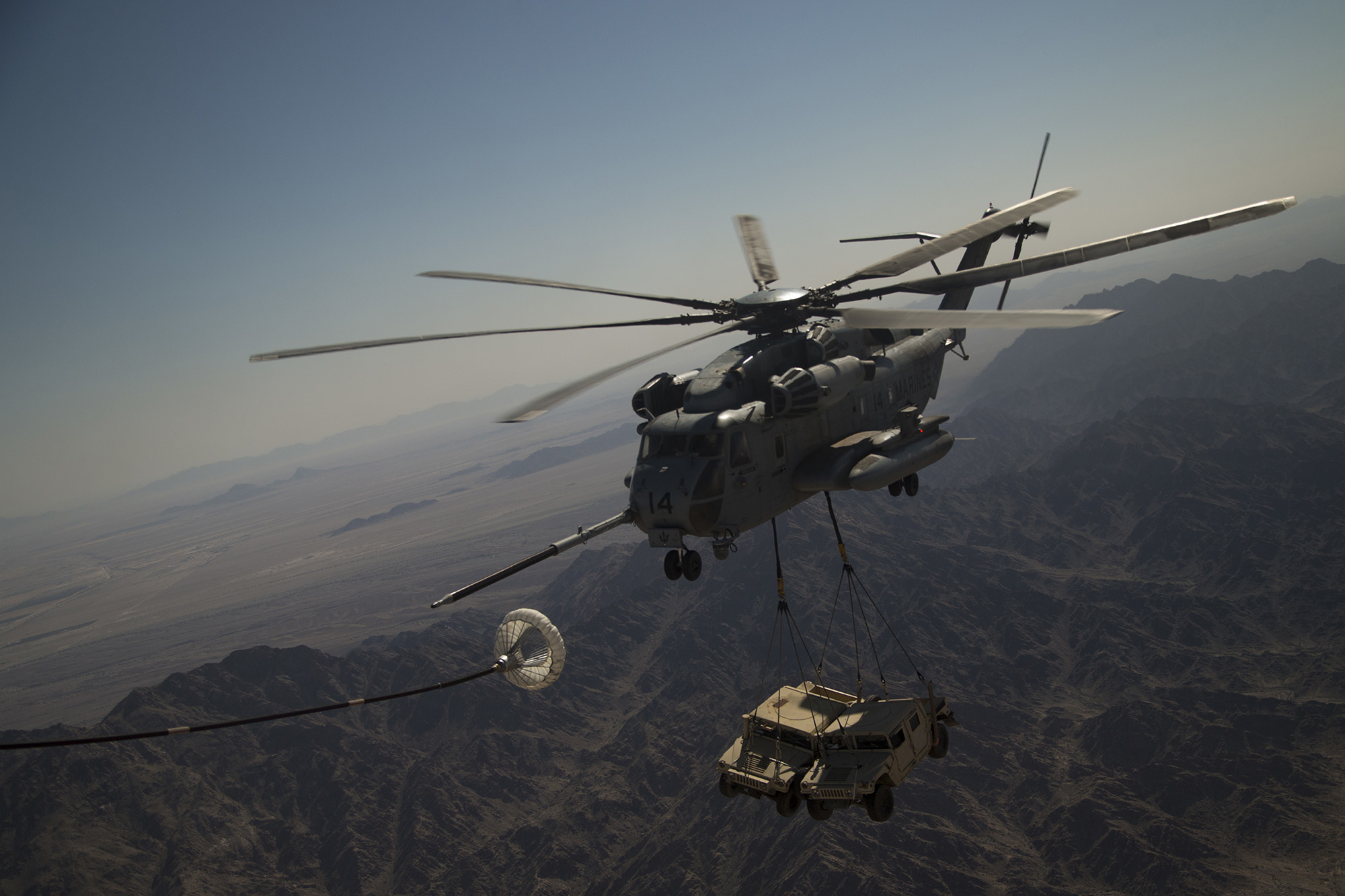 A U.S. Marine Corps CH-53E Super Stallion executes an air-to-air refuel during a heavy lift exercise in support of Weapons and Tactics Instructor (WTI) course 2-21, near Yuma, Ariz., March 31, 2021. (Lance Cpl. Camille Polete/Marine Corps)