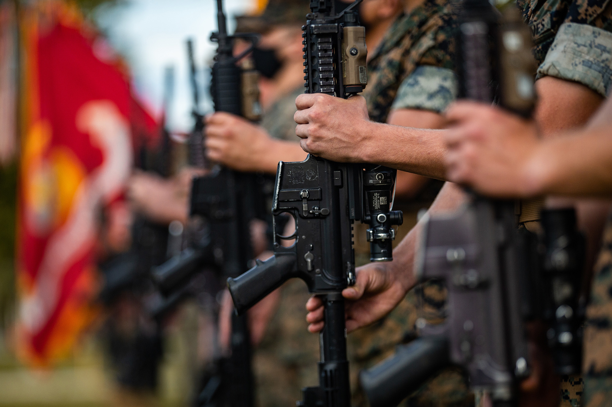 U.S. Marines present arms during a change-of-command ceremony on Camp Lejeune, N.C., Aug. 6, 2020. (Patrick King/Marine Corps)