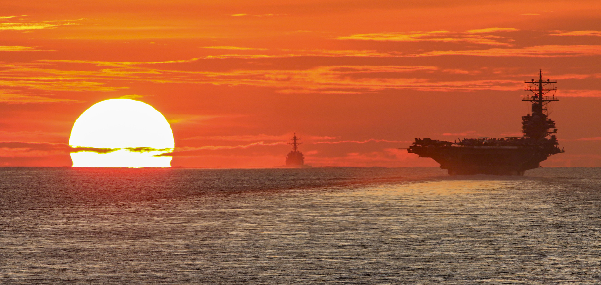 The aircraft carrier USS Ronald Reagan (CVN 76) transits the South China Sea on June 18, 2021, with the Arleigh Burke-class guided missile destroyer USS Halsey (DDG 97) and the Ticonderoga-class guided-missile cruiser USS Shiloh (CG 67). (MC1 Rawad Madanat/Navy)