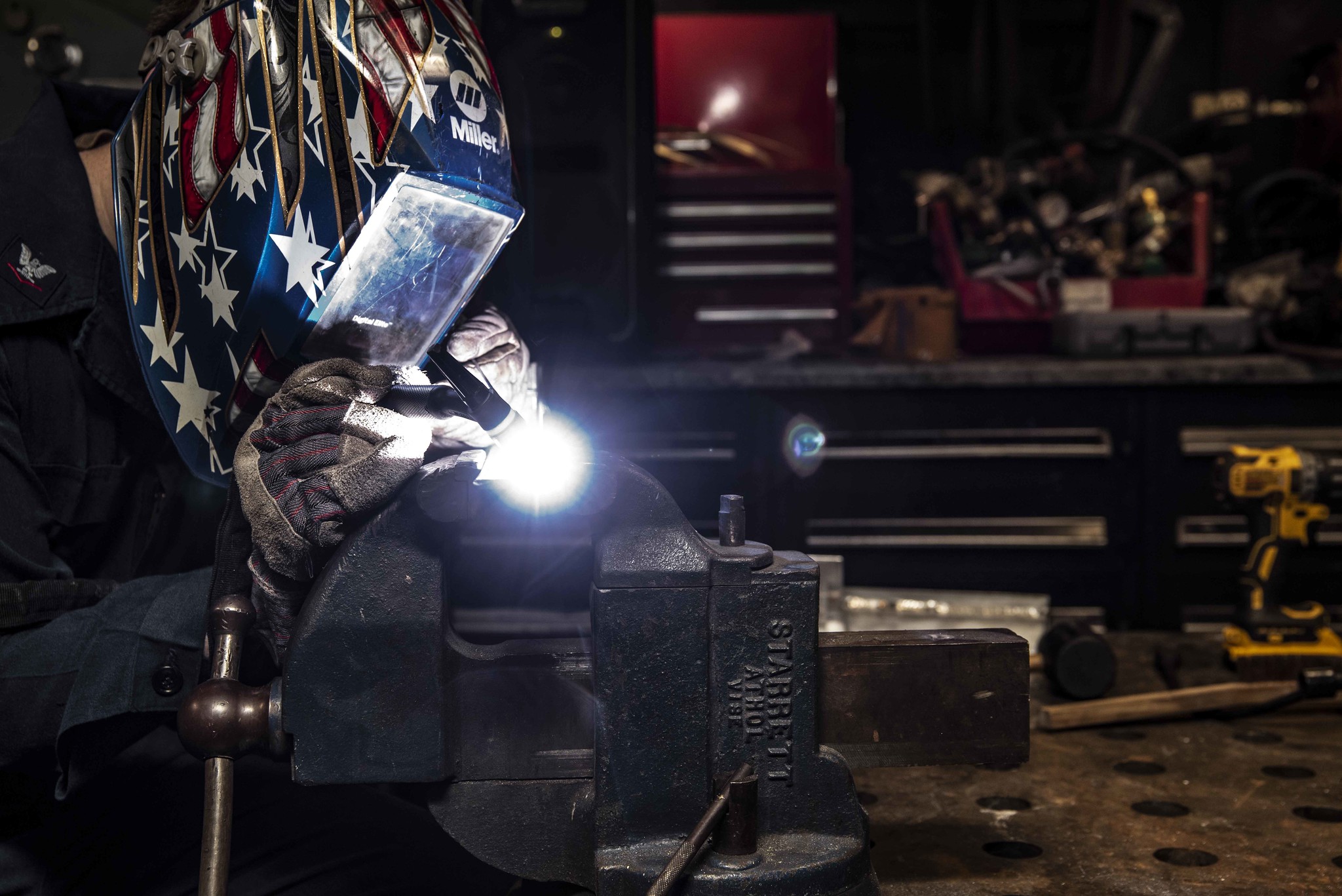 Hull Maintenance Technician 3rd Class Drew Knutson welds stainless steel and aluminum angles in the repair shop of the aircraft carrier USS Ronald Reagan (CVN 76) on July 8, 2020, in the South China Sea. (MC3 Jason Tarleton/Navy)