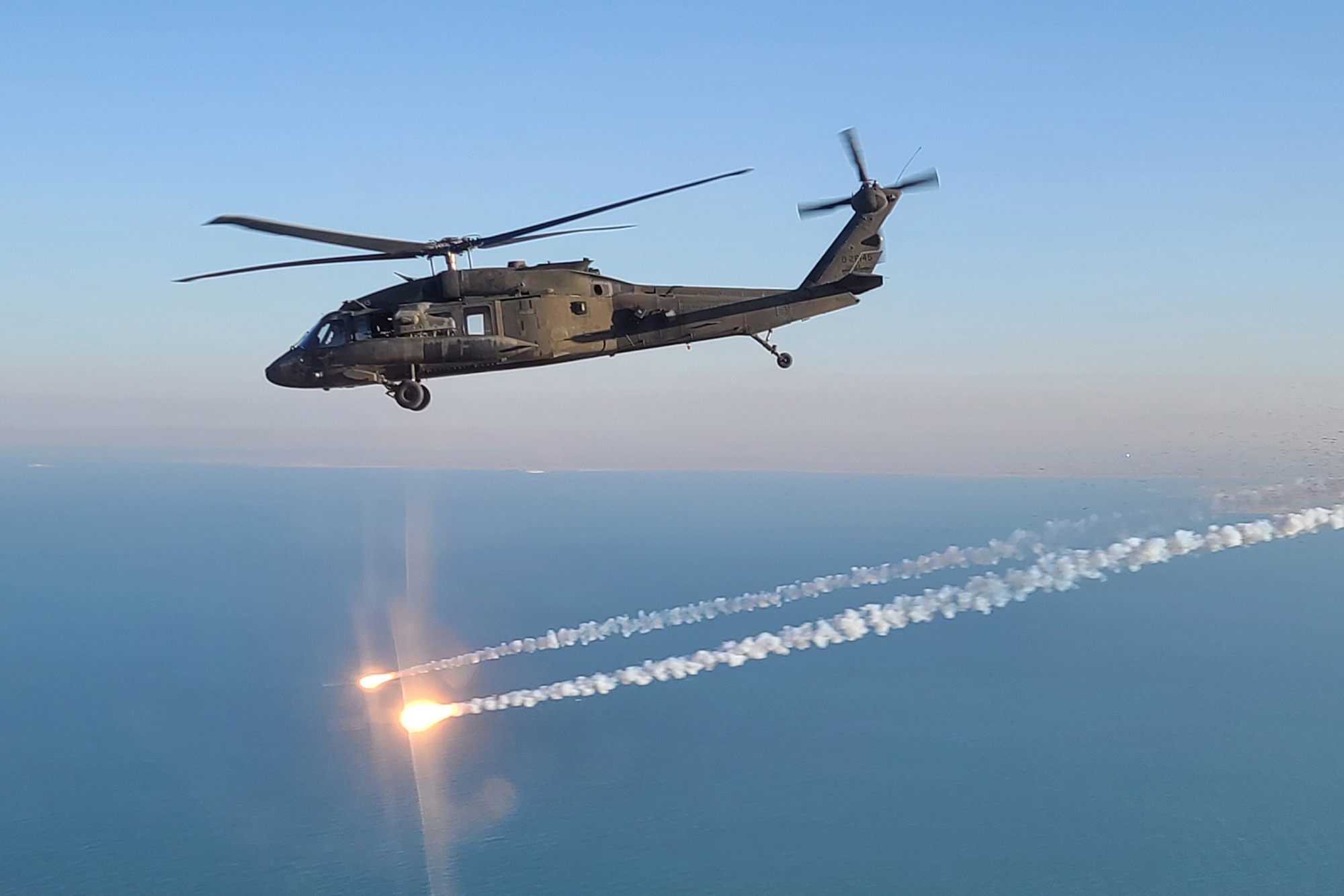 A UH-60 Black Hawk helicopter, operated by soldiers with Alpha Company, 2-104th General Support Aviation Battalion, 28th Expeditionary Combat Aviation Brigade, flies over the 28th ECAB's area of operations in the Middle East. (Sgt. Andrew Johnson/Army)