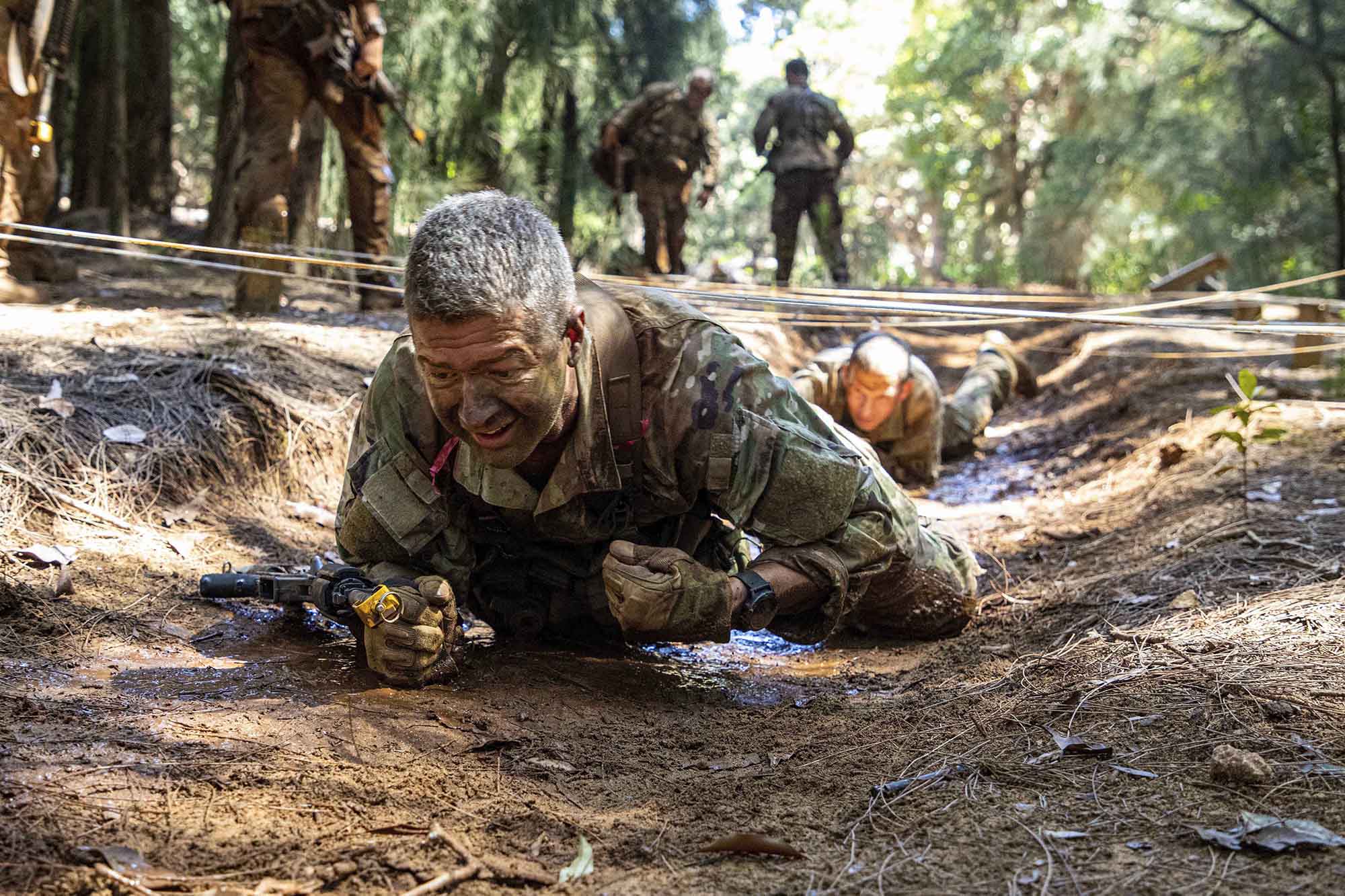 Soldiers assigned to 25th Infantry Division executed the Green Mile, a physical endurance course that concluded their training for the Jungle Operations Training Course, on April 1, 2021, at Lightning Academy near Schofield Barracks, Hawaii. (Sgt. Sarah D. Sangster/Army)