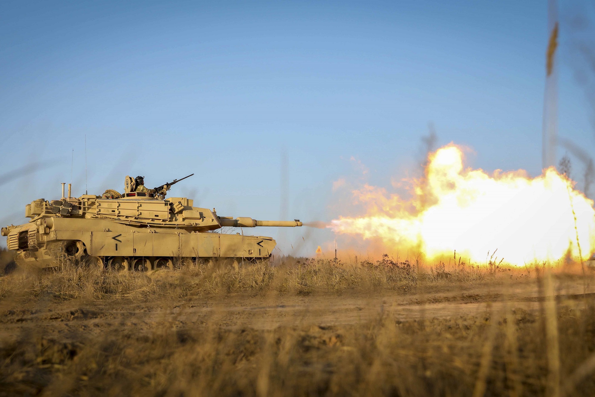 Gasses ignite as an M1 Abrams tank fires its main gun during a Dec. 10, 2020, live fire as part of the Ready to Fight operations after arriving to the Pabrade Training Area, Lithuania. (Sgt. Alexandra Shea/Army)