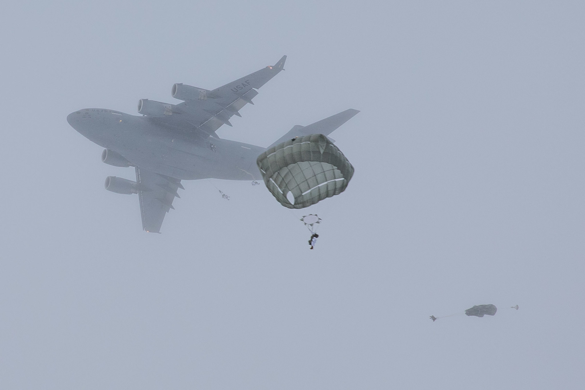 Paratroopers conduct an airborne operation at Malemute drop zone at Joint Base Elemendorf-Richardson, Alaska, Feb., 18, 2021. (Staff Sgt. Alex Skripnichuk/Army)