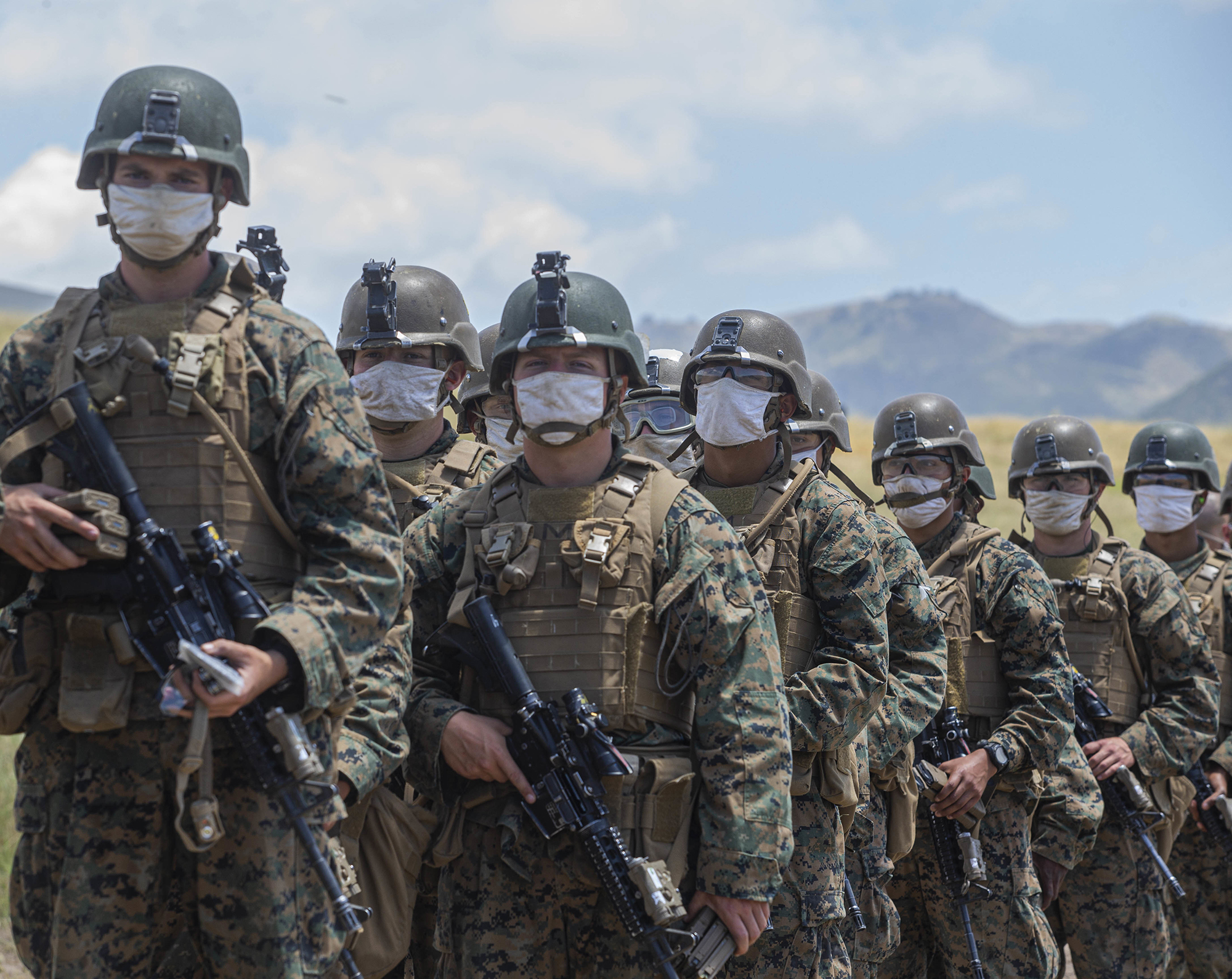 Marines with Alpha Company, Infantry Training Battalion, School of Infantry - West, wait to be lined out after live-fire training on Range 210F on Marine Corps Base Camp Pendleton, Calif., May 12, 2020. (Lance Cpl. Andrew Cortez/Marine Corps)