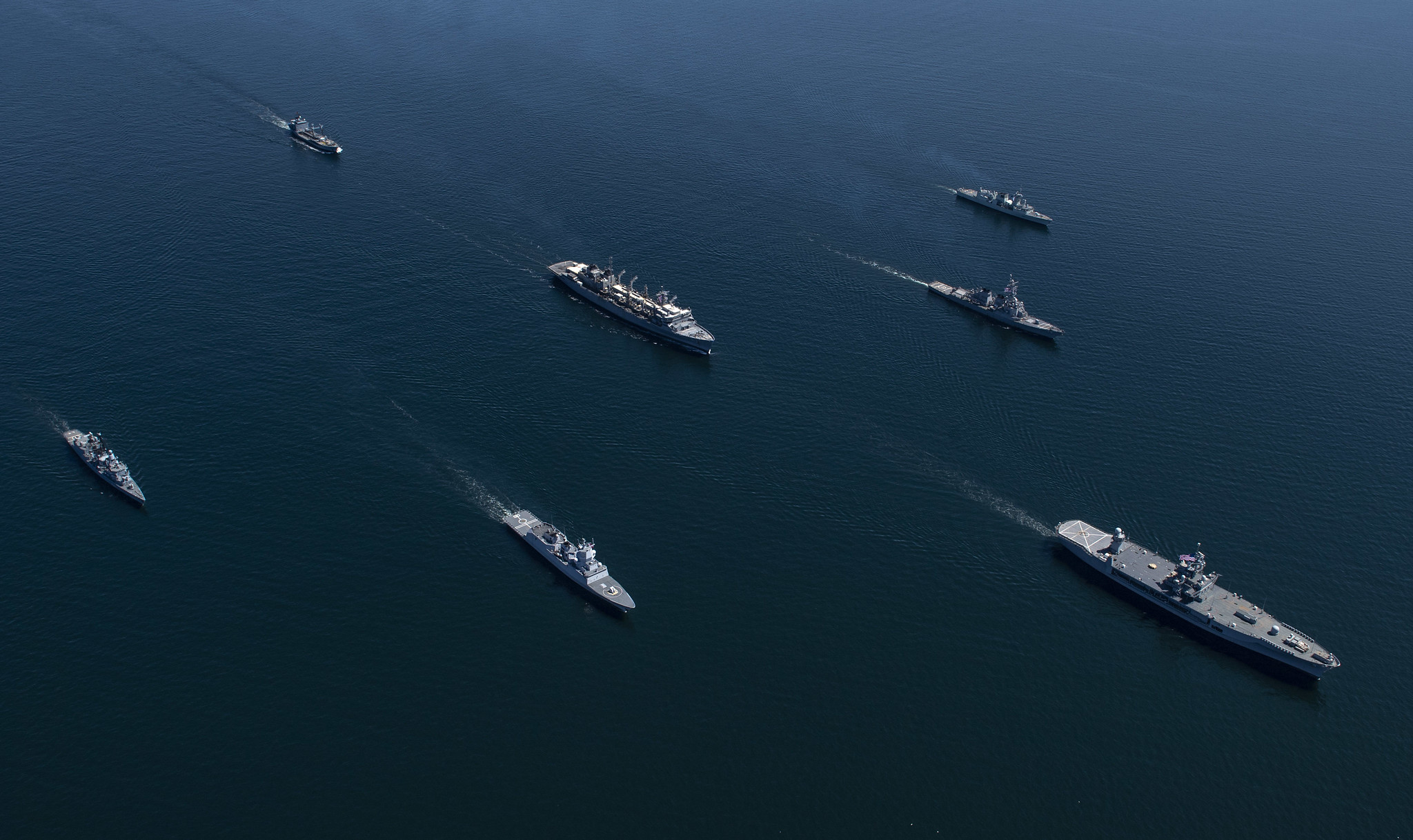 Ships from nations participating in exercise Baltic Operations (BALTOPS) 2020 sail in formation while in the Baltic Sea, June 8, 2020. The ships pictured in alphabetical order by home nation are the Royal Canadian Navy Halifax-class frigate HMCS Fredericton (FFH 337), the German navy Bremen-class frigate FGS Luebeck (F214) and the Rhone-Class replenishment oiler FGS Rhoen (A1443), the Royal Norwegian Navy Fridtjof Nansen-class frigate HNoMS Otto Suerdrup (F312), the U.S. Navy Blue Ridge-class command and control ship USS Mount Whitney (LCC 20), the Arleigh Burke-class guided-missile destroyer USS Donald Cook (DDG 75) and the Supply-class fast-combat support ship USNS Supply (T-AOE 6). (MC1 Kyle Steckler/Navy)