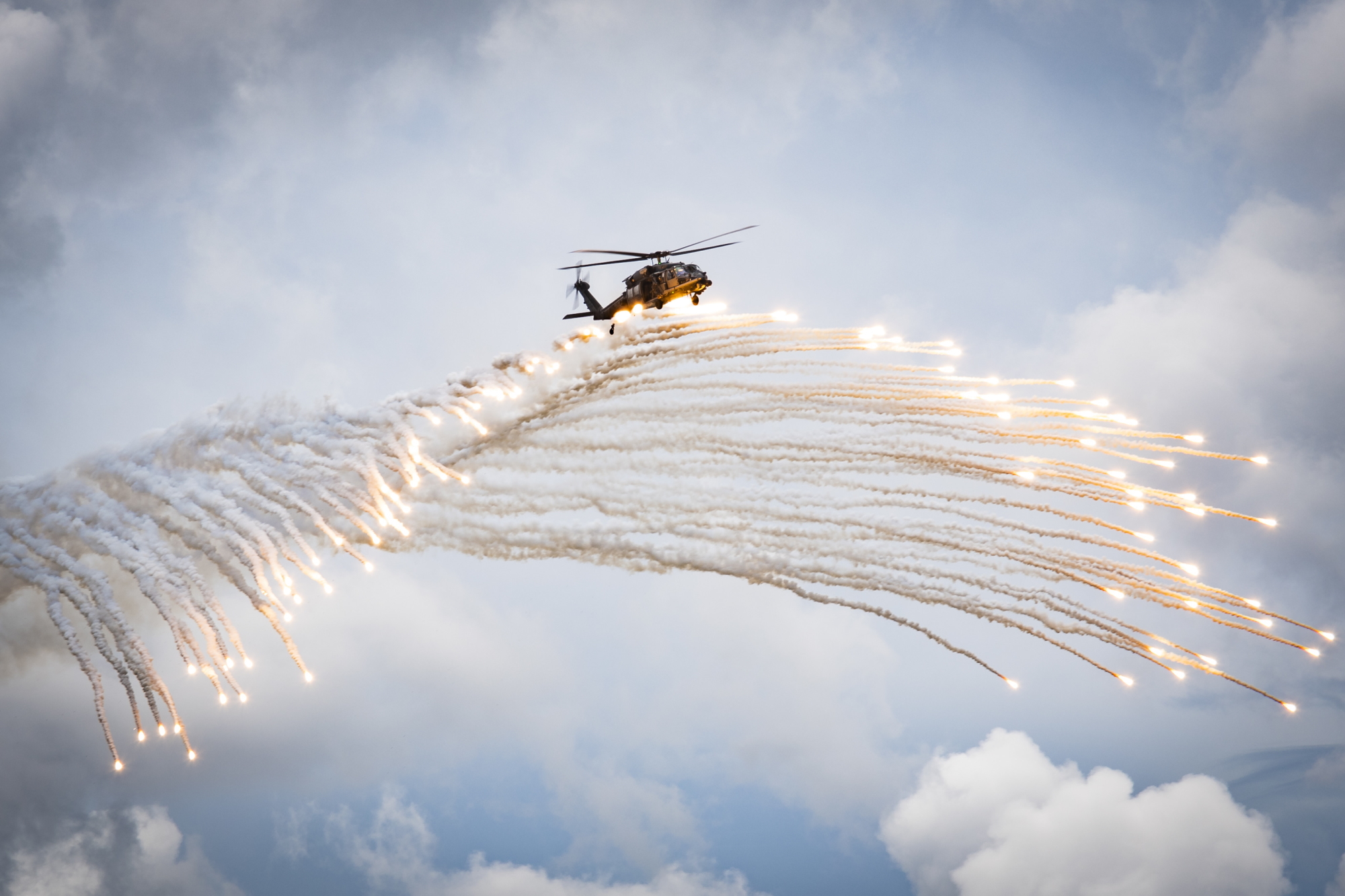 Airmen assigned to the 347th Rescue Group drop flares during a fini flight for Col. Bryan Creel, 347th RQG commander, June 5, 2020, at Moody Air Force Base, Ga. The fini flight is a long-standing Air Force tradition that occurs when a pilot departs from the base. Creel will move on to Incirlik Air Base, Turkey, where he will command the 39th Air Base Wing. (Senior Airman Hayden Legg/Air Force)
