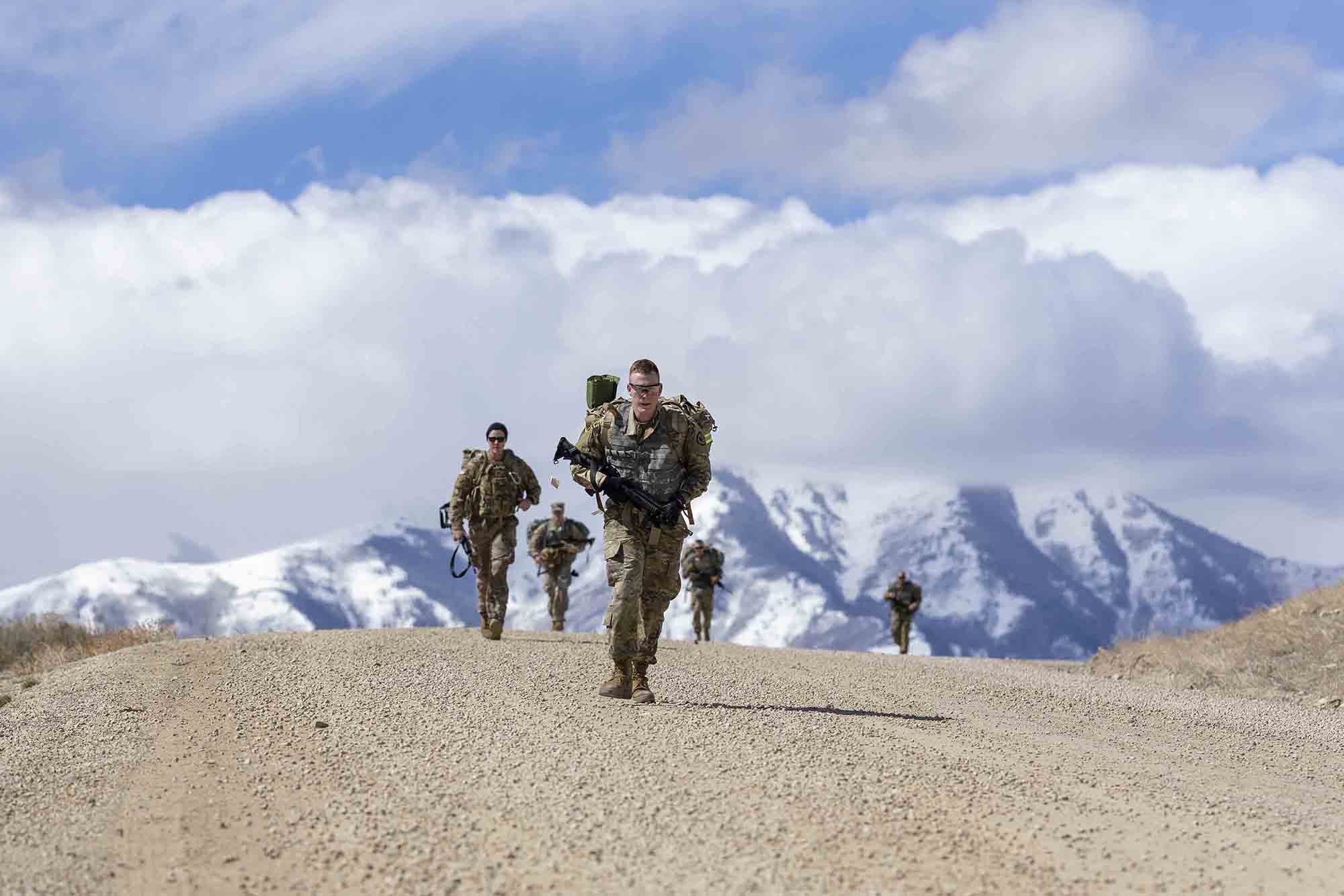 Soldiers endure a 6-mile ruck march back to garrison during the Utah National Guard Best Warrior Competition at Camp Williams, Utah, March 23, 2021. (Spc. Bryton Bluth/Army National Guard)