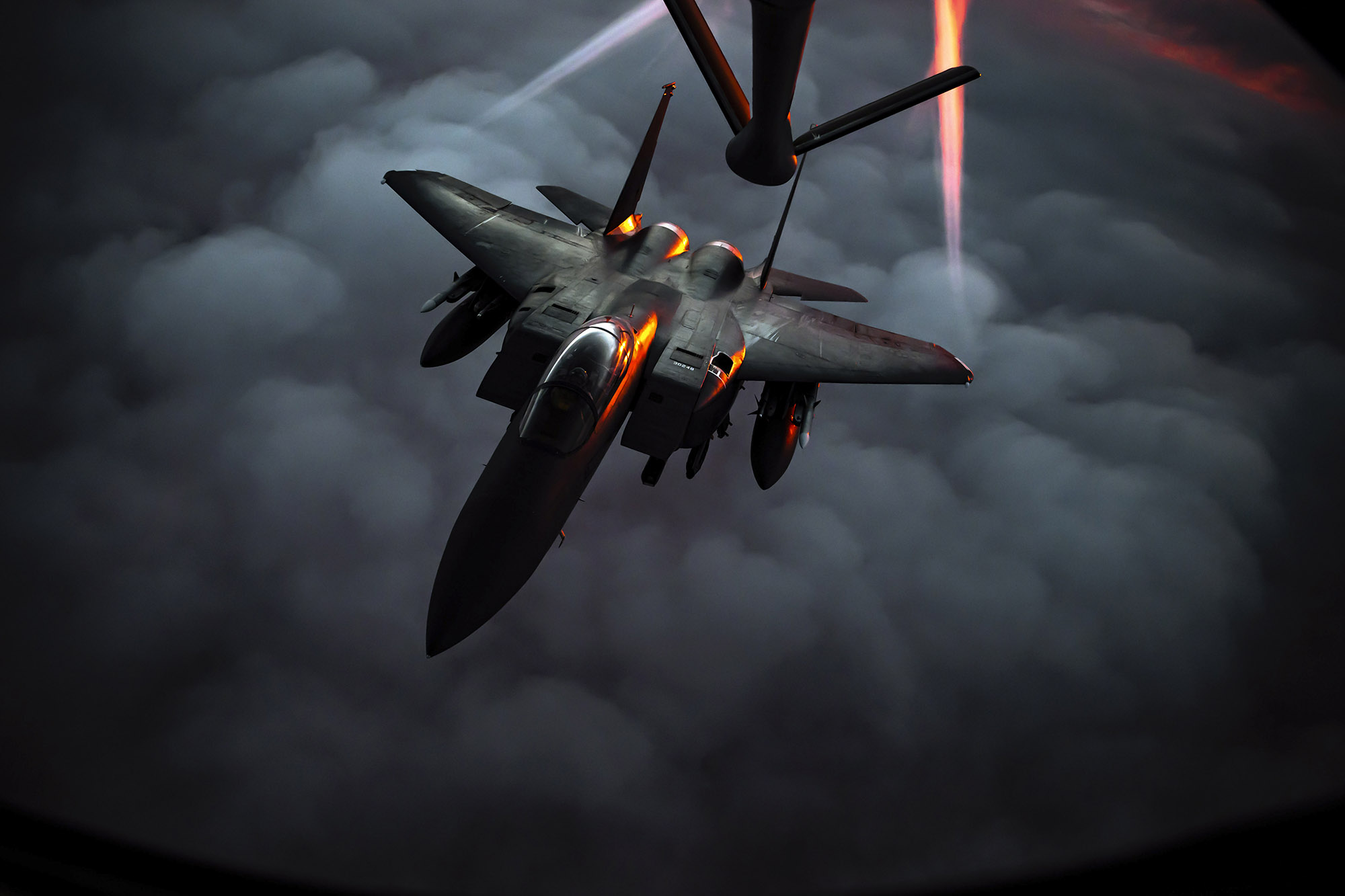 A U.S. Air Force F-15E Strike Eagle departs after receiving fuel from a U.S. Air Force KC-135 Stratotanker during an air refueling mission over Southwest Asia, Dec. 22, 2020. (Staff Sgt. Trevor T. McBride/Air Force)
