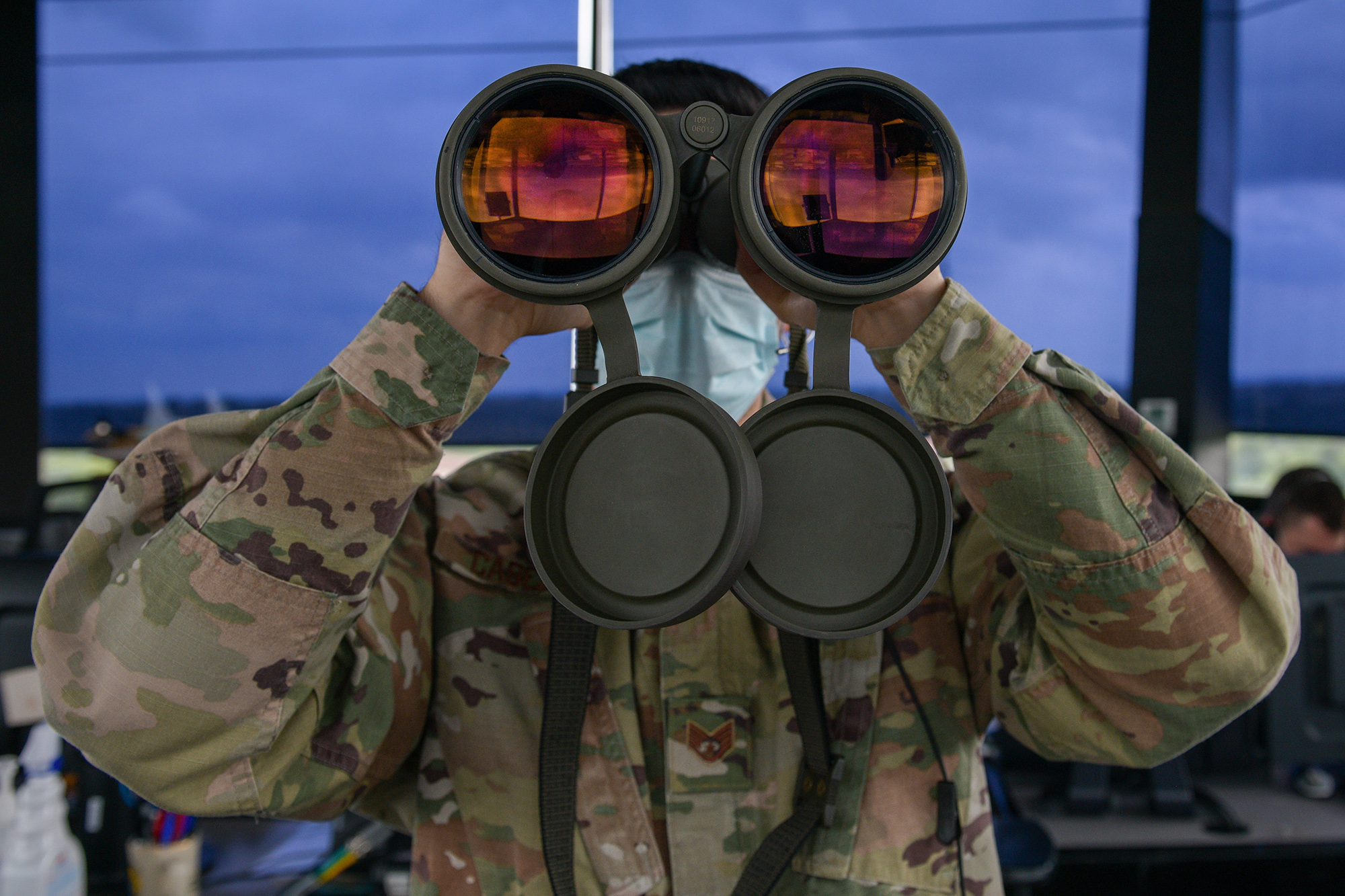 Air Force Staff Sgt. Daniel Cabezas scans the horizon for landing lights and obstructions on the flightline at Aviano Air Base, Italy, May 7, 2021. (Airman 1st Class Brooke Moeder/Air Force)