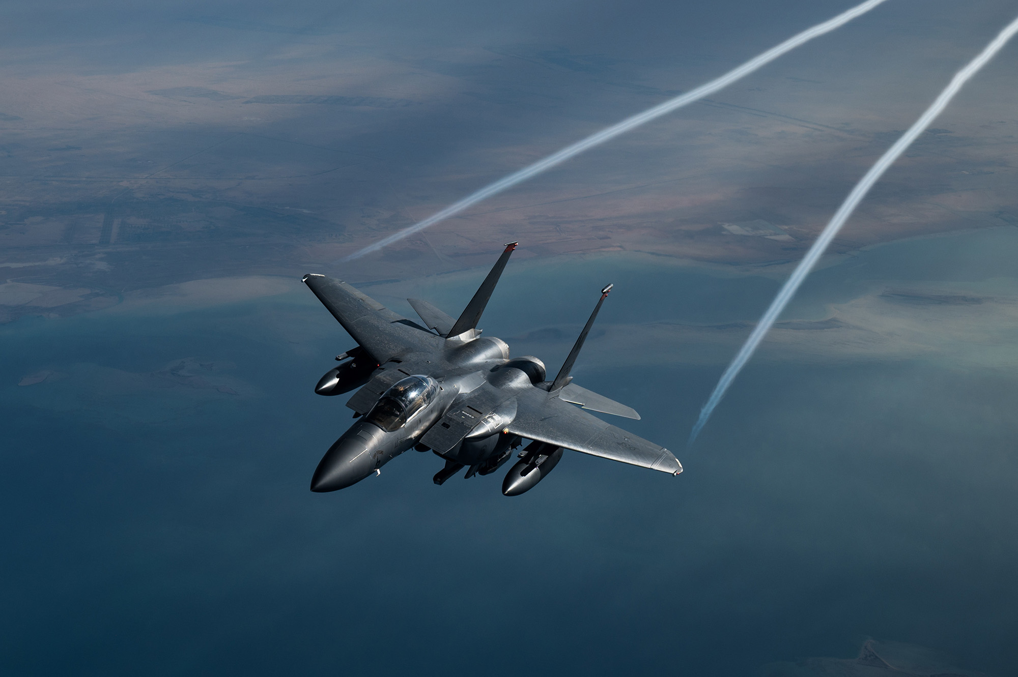 A U.S. Air Force F-15 Strike Eagle flies over the U.S. Central Command area of responsibility, Feb. 10, 2021.(Staff Sgt. Sean Carnes/Air Force)