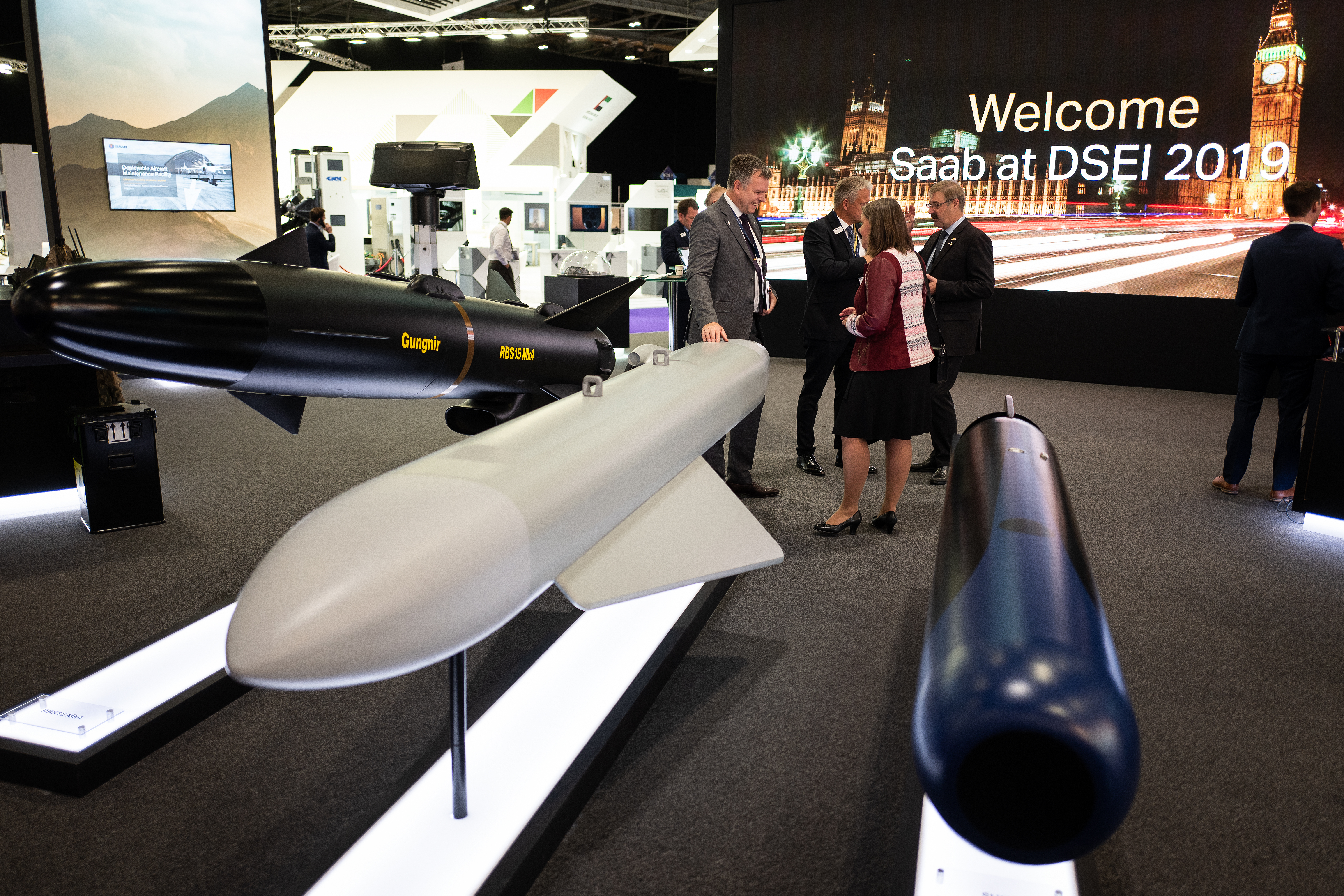 From left, an RBS15 Mark 4, an Arexis jammer pod and an SLWT are seen at the Saab display stand during the DSEI arms fair. (Leon Neal/Getty Images)