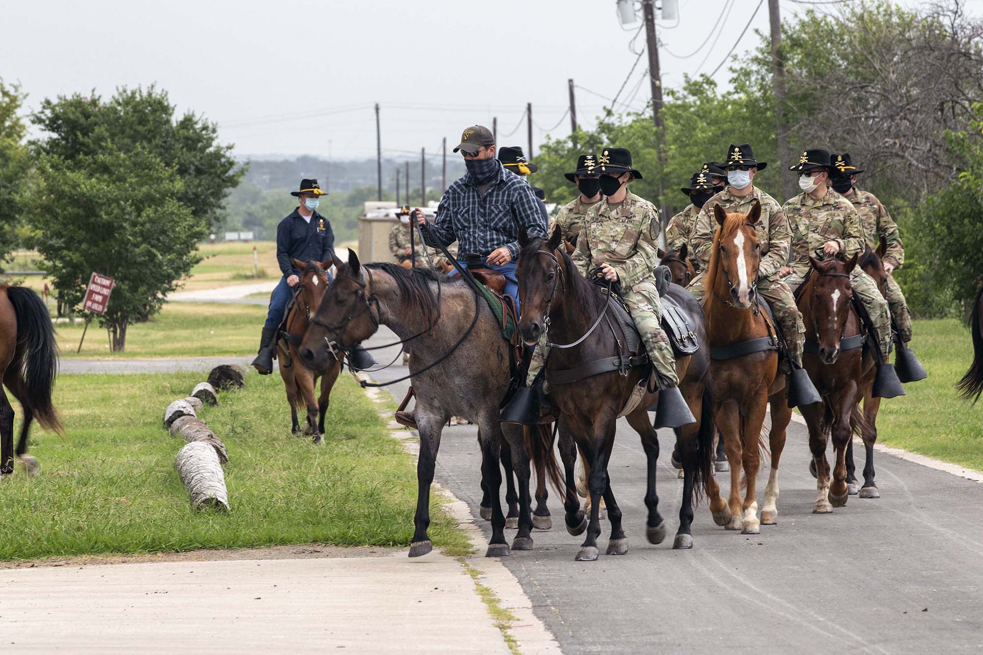 Senior leaders and command teams from 1st Cavalry Division Sustainment Brigade come together in First Team tradition for a trail ride led by the 1st Cavalry Division Horse Detachment, Fort Hood, Texas, July 1, 2020. (Sgt. Calab Franklin/Army)