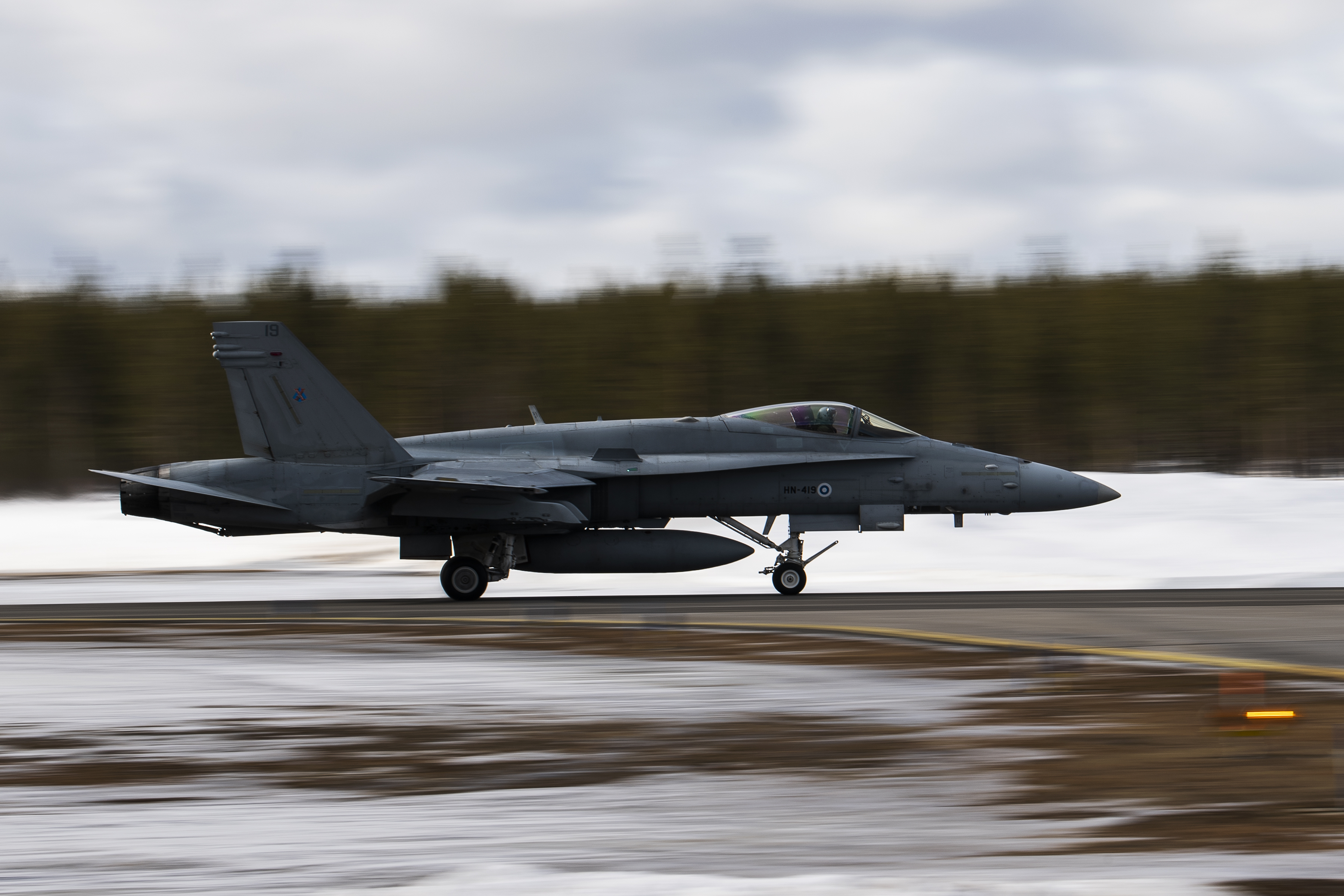 A Finnish F-18 Hornet departs from Jokkmokk Air Base during a joint exercise between the air forces of Finland and Sweden over the Arctic Circle towns of Jokkmokk in Sweden and Rovaniemi in Finland on March 25, 2019. (Jonathan Nackstrand/AFP via Getty Images)