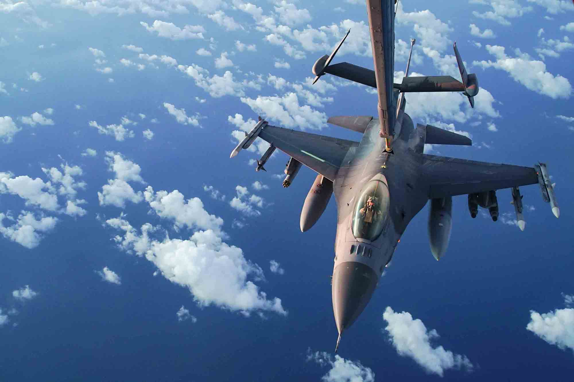 A U.S. Air Force F-16 Fighting Falcon receives fuel from a U.S. Air Force KC-10 Extender during an n-air refueling mission supporting Operation Octave Quartz with armed over-watch in Africa, Jan. 9, 2020. (Staff Sgt. Taylor Harrison/Air Force)