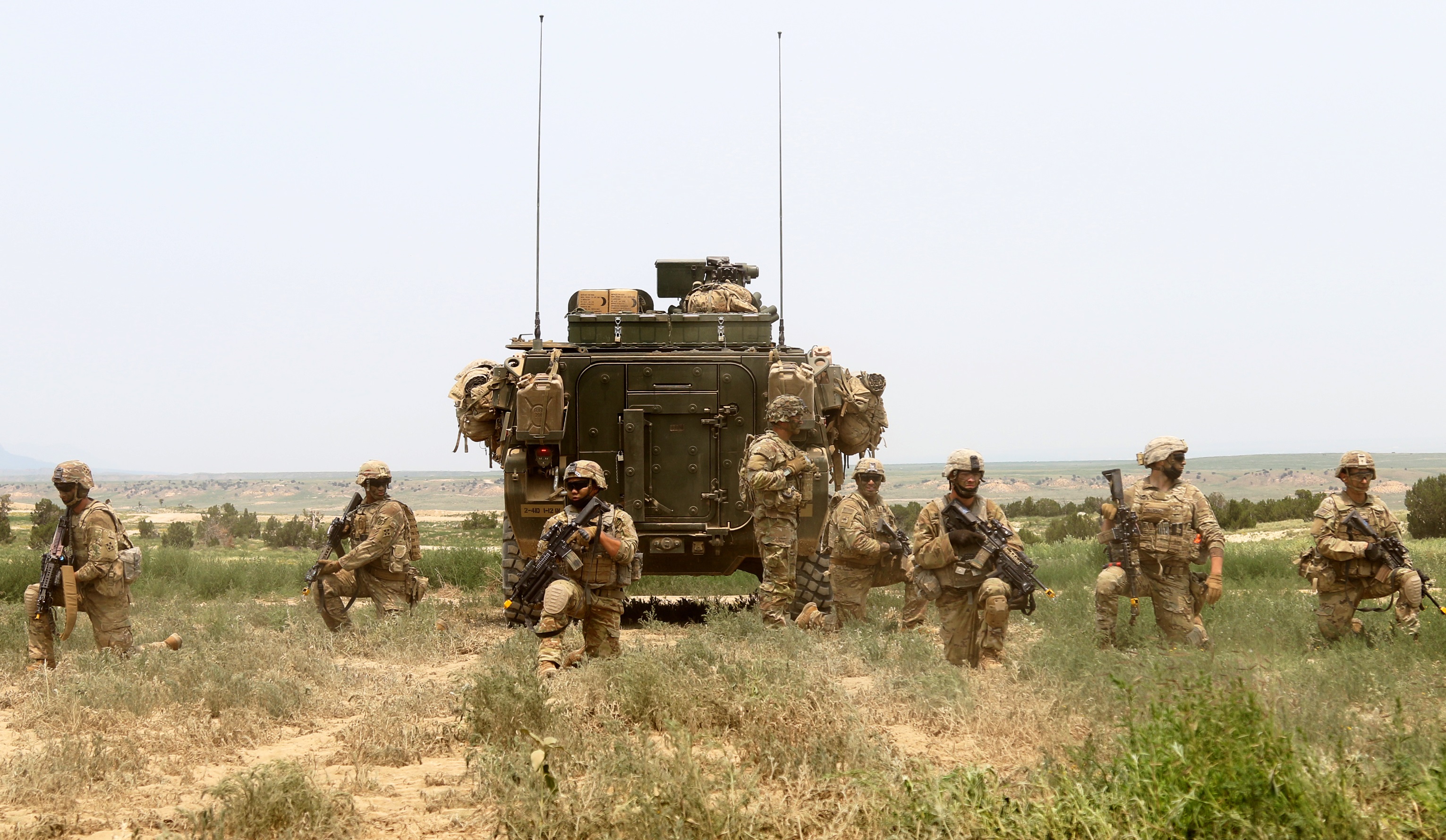 Soldiers with 1st Battalion, 12th Infantry Regiment, 2nd Stryker Brigade Combat Team, 4th Infantry Division, pull security during a platoon live-fire exercise July 12 at Fort Carson, Colo. The Warhorse Brigade's training aligns with its upcoming training rotation to Fort Irwin, Calif. (Maj. Jason Elmore/Army)