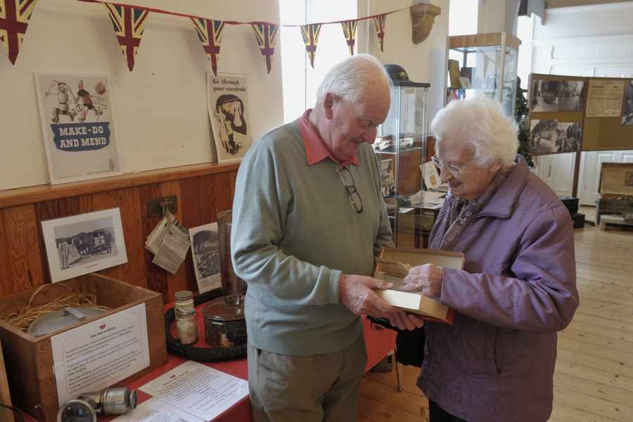 David Isherwood and his sister Dorothy Jordan looking through a box of old letters