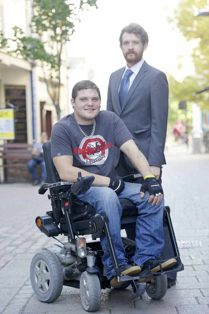 Daniel Clark (in wheelchair) who was arrested for growing cannabis which he used for medicinal purposes, with Chris Magee
