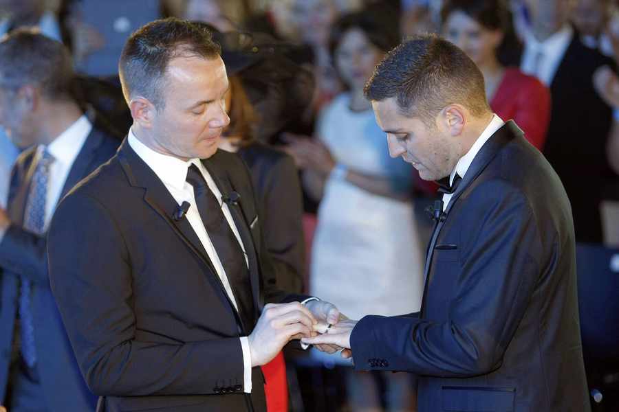 The first couple to marry in France after the French government voted a new law legalizing same-sex marriage. (AP Photo/Claude Paris)