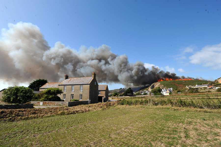 Huge swathes of countryside were destroyed in 2009 when a fire ripped through the L'Etacq area of St Ouen. More than 75,000 sq ft of furze was destroyed, with large areas of plants, shrubs and trees reduced to charred patches and stumps. A total of 15 homes in the area were evacuated after the blaze broke out and firefighters worked for hours to control and extinguish the flames. Large clouds of smoke were visible from town when the alarm was raised at around 3 pm. The States Fire and Rescue Service broadcast a radio message in an attempt to rally off-duty and retained firefighters to help with the emergency. It came as thousands watched the popular annual Jersey International Air Display that year. At the height of the blaze 26 firefighters, four fire engines, seven firefighting jets and two water carriers were at the scene.