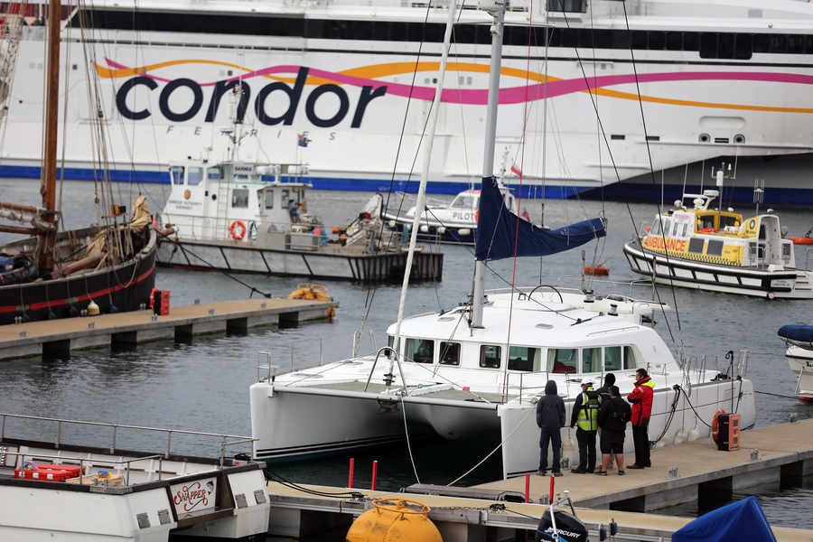 Condor Liberation and the damaged yacht Picture: PETER FRANKLAND, GUERNSEY PRESS