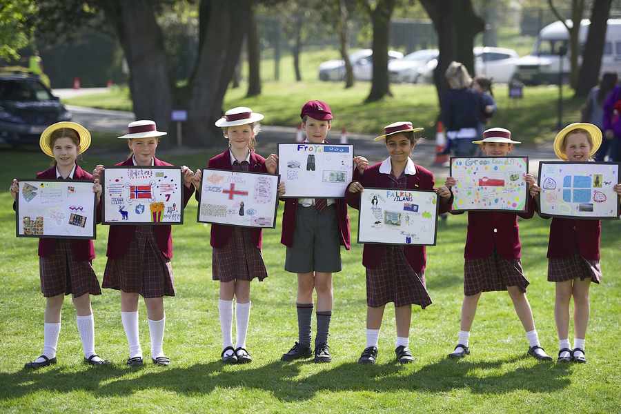 St George's School pupils show off their various island posters