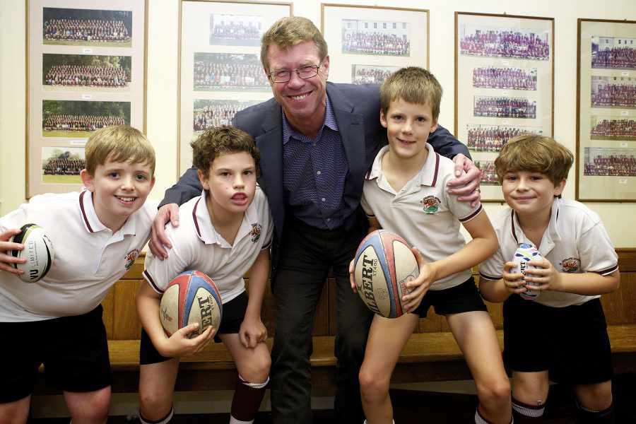 The former scrum-half met children from St George's and St Michael's Schools during his trip to the Island
