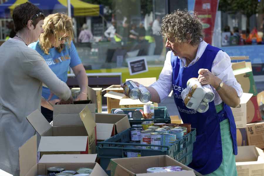 Rosemary Coote (right) packing boxes.