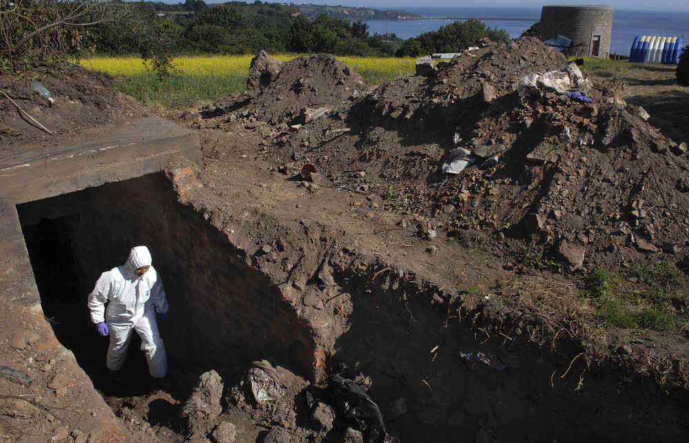 Investigators explore a bunker in the grounds of Haut de la Garenne