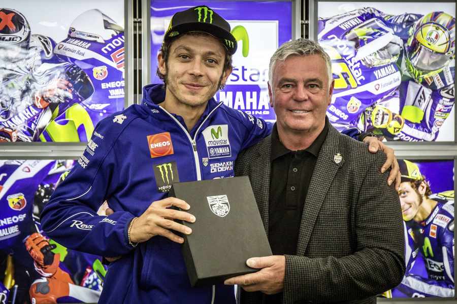 MotoGP legend Valentino Rossi receives his honorary membership of the British Racing Drivers' Club from BRDC president Derek Warwick at Silverstone. Picture: Matt Gardiner