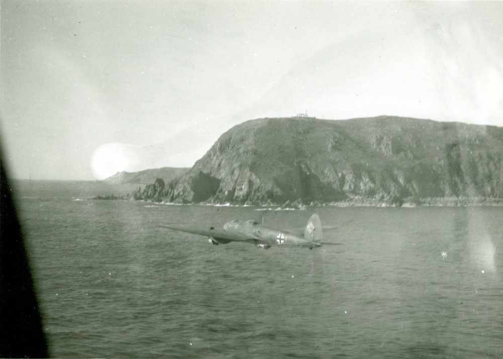 A German aircraft flies low over the Channel Islands