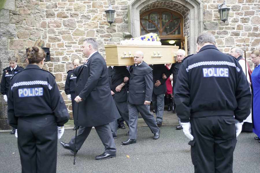 Funeral of Mitch Couriard as the hearse passes the Town Hall after the funeral