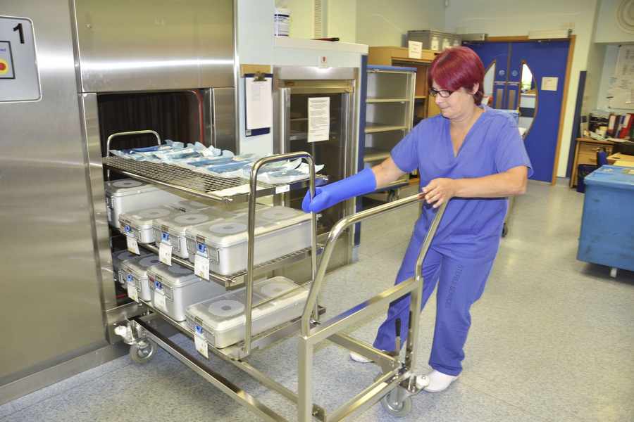 Senior team leader Louise Langlois removes a trolley from the sterilisation room