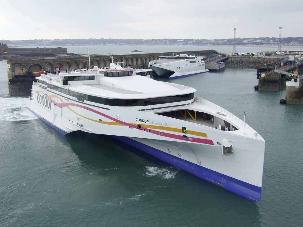 A tight squeeze as Condor Liberation manoeuvres into its berth with the old Condor Express, which has been sold, behind Picture: PHILIP JEUNE
