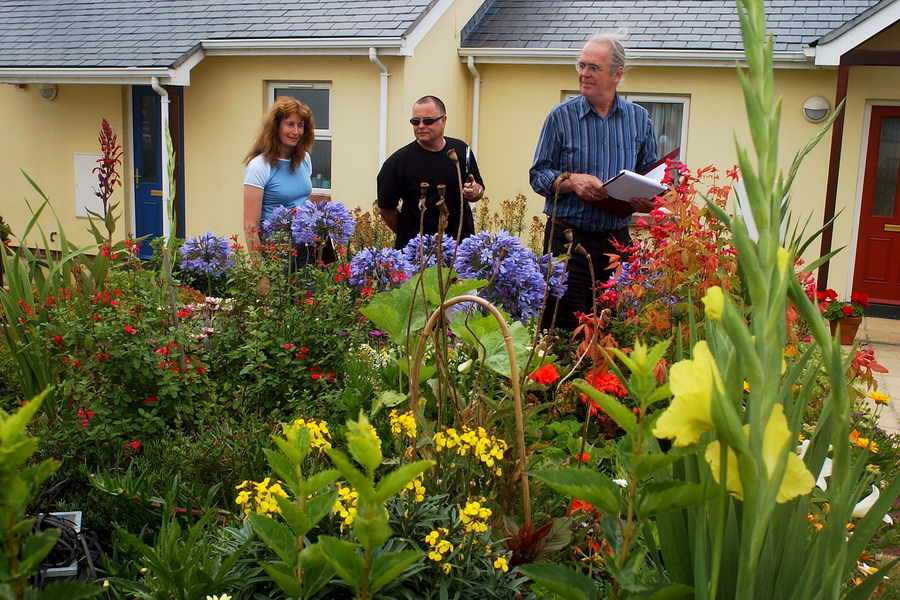 Bruce Labey, centre, joins fellow Parish in Bloom judges Carole Baxter and Mike Freeman to review a St Martin entry