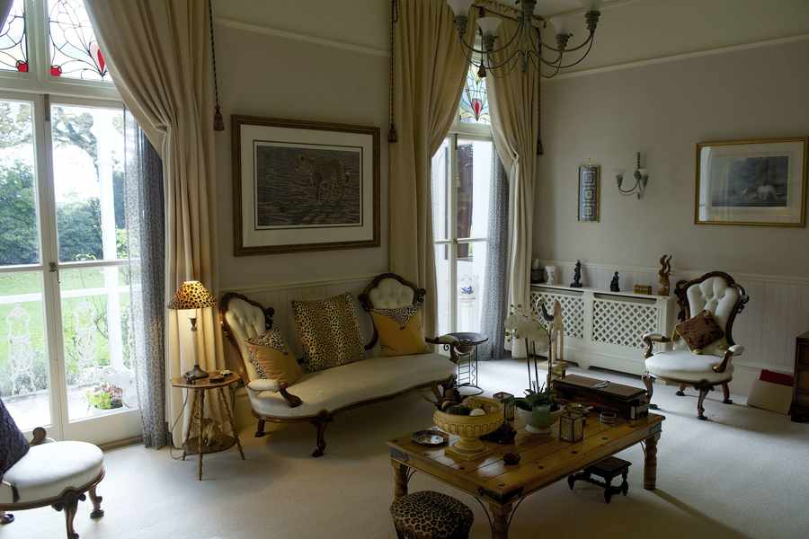 The drawing room has soft furnishings and artwork