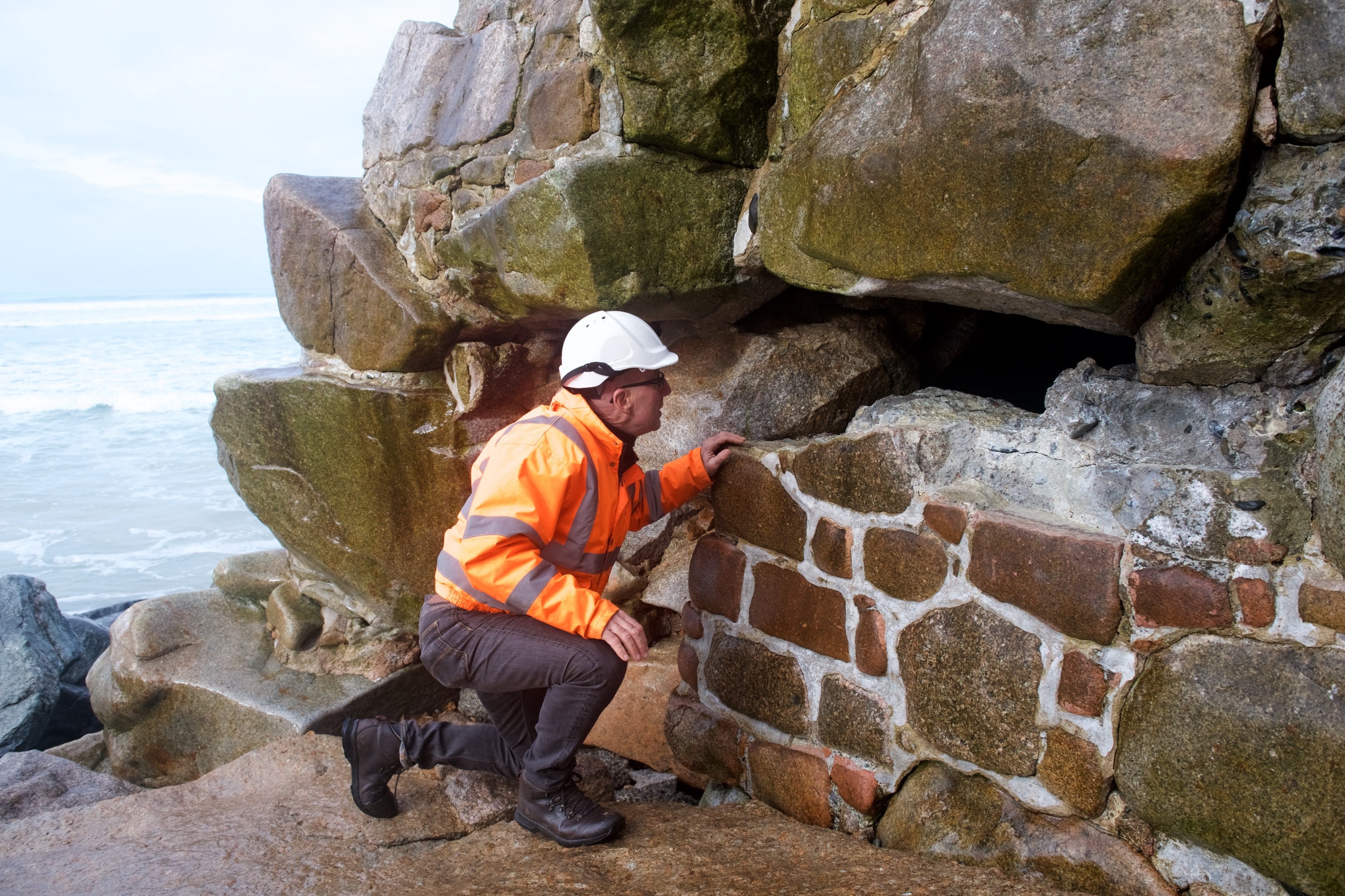 Dave O'Brien, Civil Works Manager from IHE assesses the damage at El Tico. The hole goes from the bottom of the wall to the top. Picture: JON GUEGAN. (30250634)