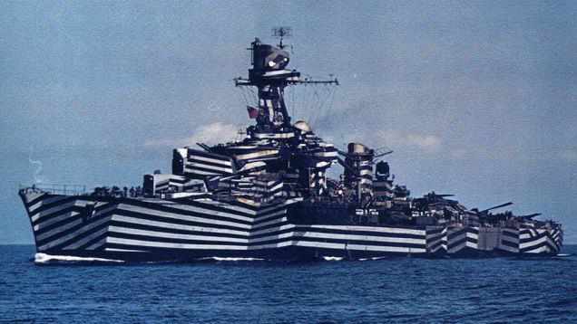 A warship painted with dazzle camouflage