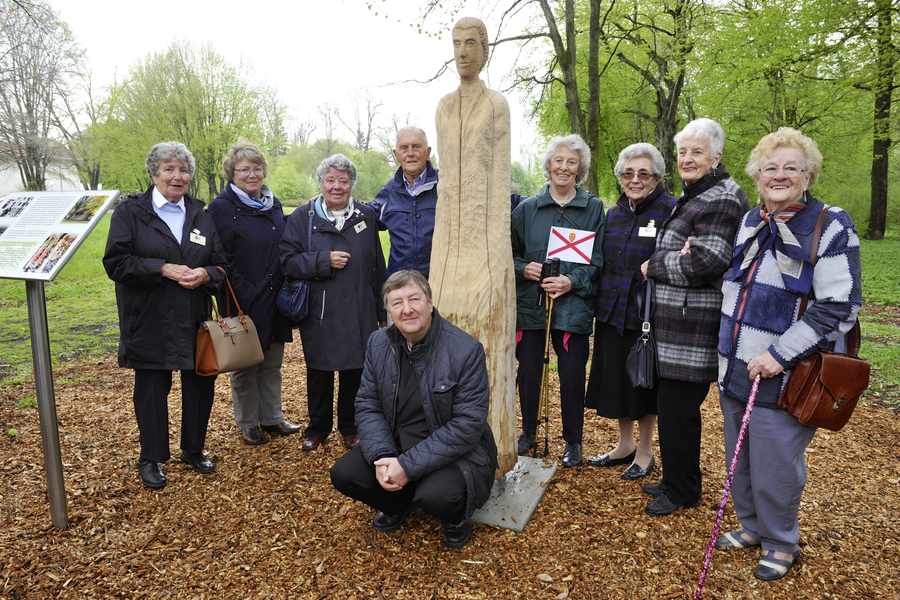 Sculptor Robert Koenig, who unveiled a special commemorative carving 'The Uprooted', with former internees (from left) Sandra Armstrong, Angela Thom, Gloria Bullen, Tony Barnett, Collette Falle, Pat Holt, Maisie Plain and Gwen Bisson