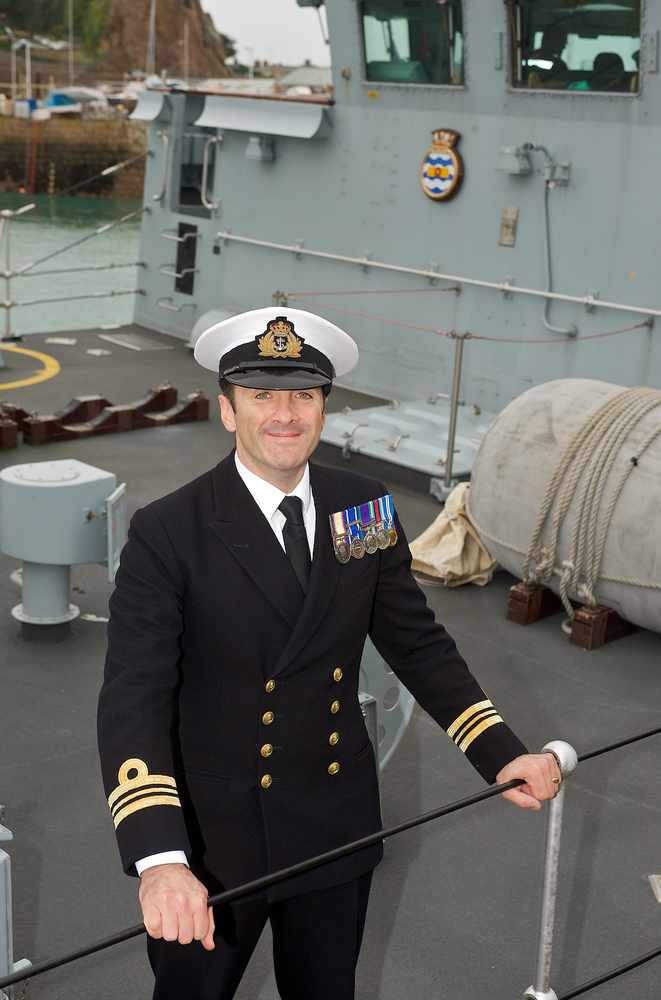 Commander Marcus Jacques aboard HMS Walney during a visit to Jersey in 2009