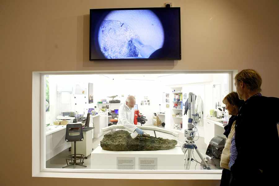 Jersey Museum conservator Neil Mahrer working on the hoard at La Hougue Bie