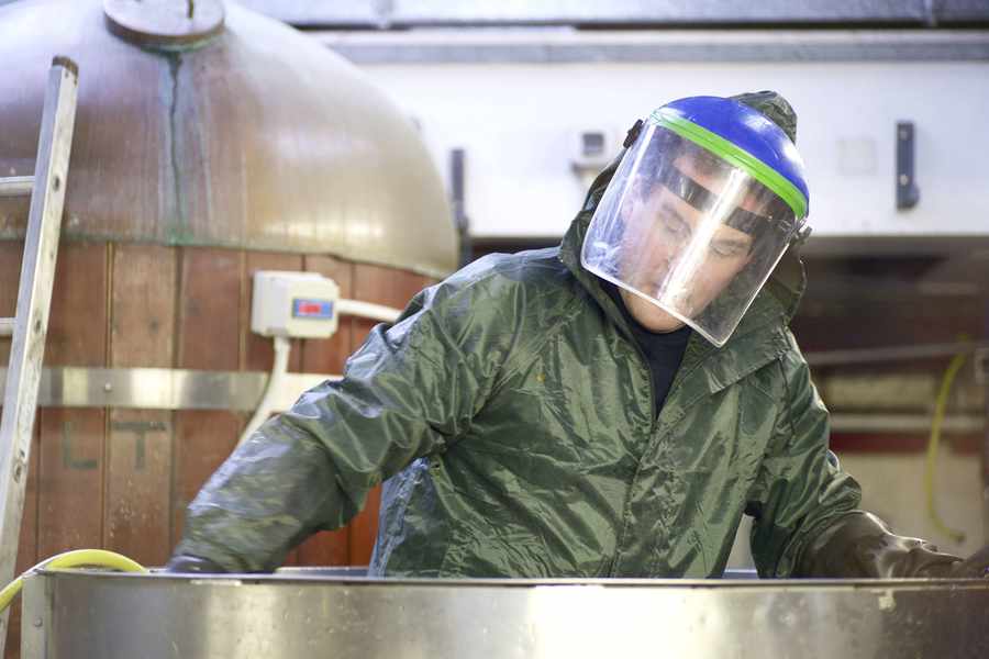 Paul Hurley cleans one of the fermenting vessels