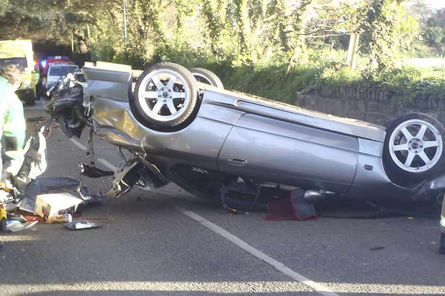 A driver was banned after a crash left a passenger with a broken back