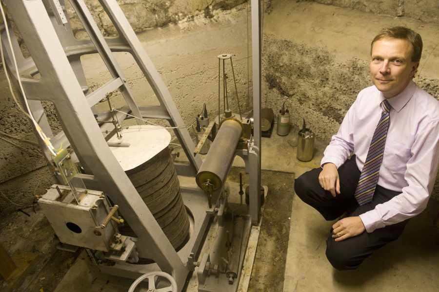 Paul Aked, Senior Meteorologist, Jersey Met in the basement at the St Louis Observatory alongside the original Mainka seismometer and its modern counterparts.