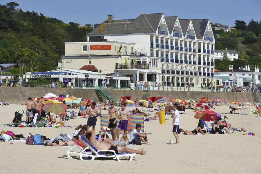 Tourists on a busy St Brelade's beach