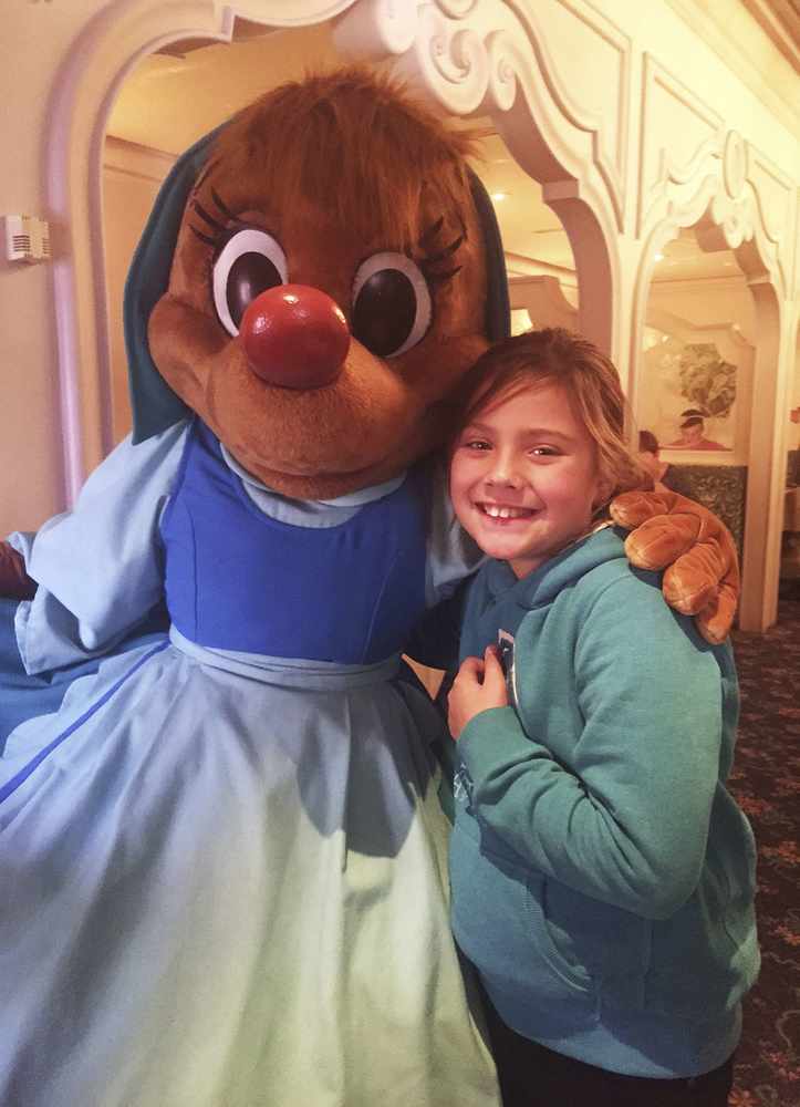 Julia Ford (9) meets a character during her all-expenses-paid visit to Disneyland Paris